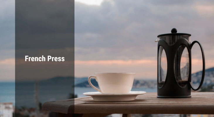 French Press and a Cup on a table
